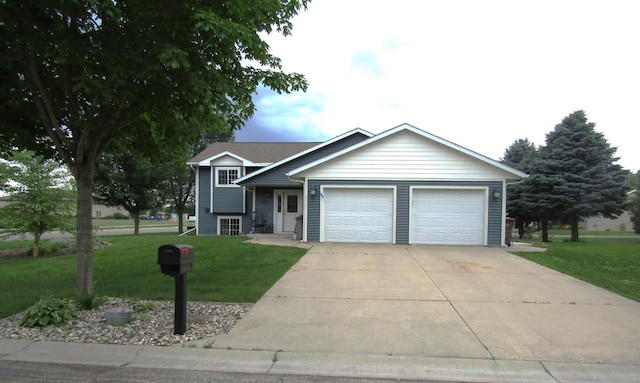 1103 15th St, Montevideo, MN 56265 - tri-level home featuring a front yard, a garage, and driveway