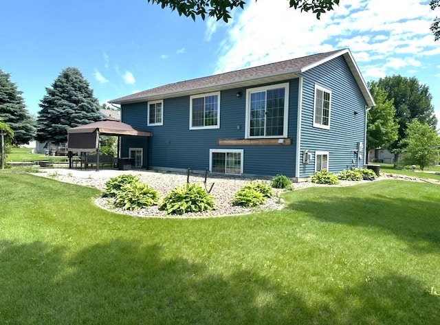 1103 15th St, Montevideo, MN 56265 - rear view of house with a gazebo, a yard, and a patio area