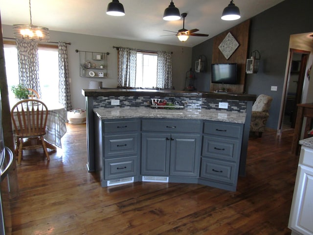 1103 15th St, Montevideo, MN 56265 - kitchen with ceiling fan, dark wood-type flooring, decorative light fixtures, a center island, and open floor plan