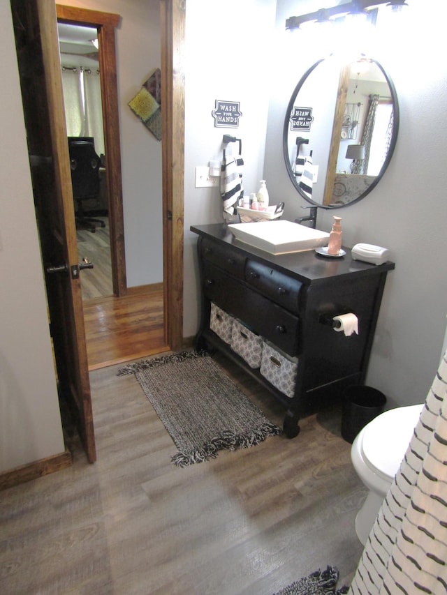 1103 15th St, Montevideo, MN 56265 - half bath featuring wood finished floors and vanity