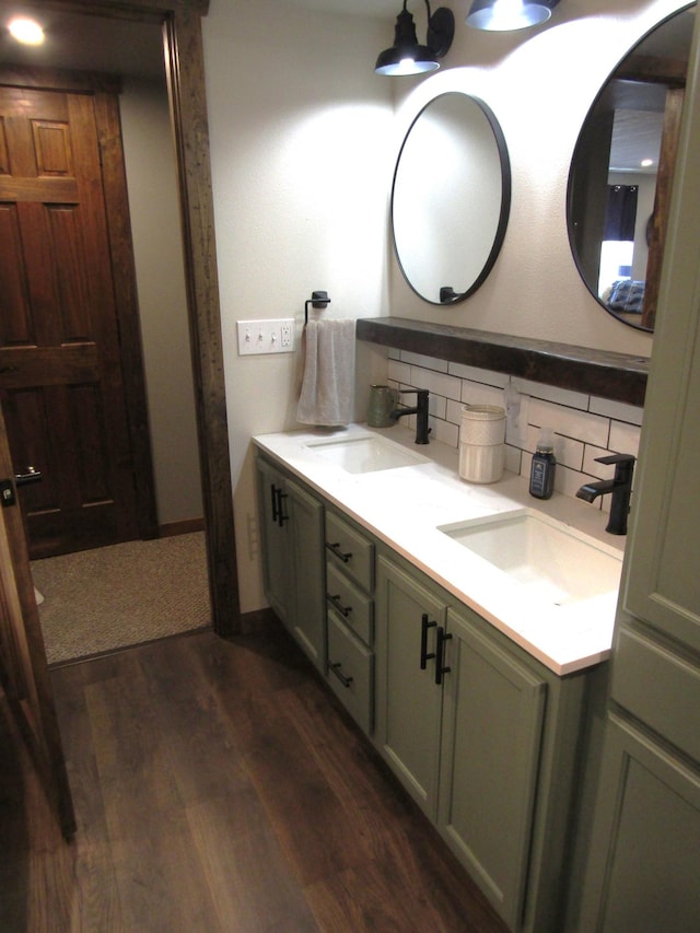 1103 15th St, Montevideo, MN 56265 - full bath featuring backsplash, double vanity, and wood finished floors
