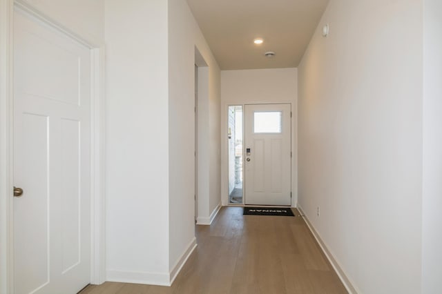 15149 Quince St NW, Andover, MN 55304 - doorway to outside featuring light wood finished floors and baseboards