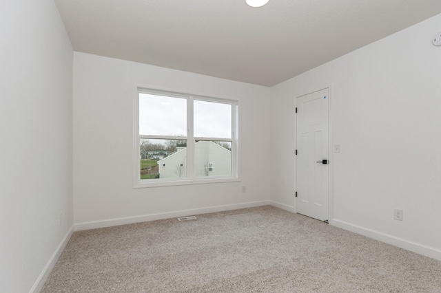 4021 Heath Ln N, Oakdale, MN 55128 - spare room with light colored carpet and baseboards