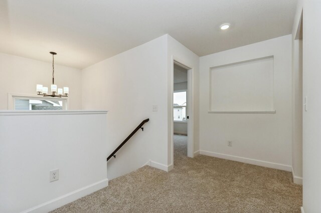 4021 Heath Ln N, Oakdale, MN 55128 - carpeted spare room featuring a chandelier and baseboards