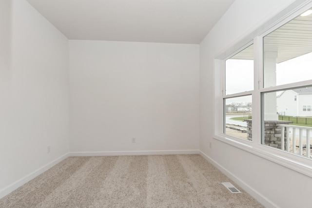 4021 Heath Ln N, Oakdale, MN 55128 - carpeted spare room featuring baseboards