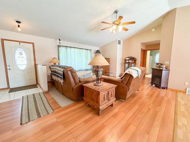 915 Stanton Ave, Fergus Falls, MN 56537 - living area featuring a ceiling fan, plenty of natural light, light wood-style floors, and vaulted ceiling