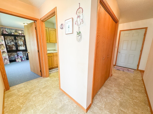 915 Stanton Ave, Fergus Falls, MN 56537 - hall with a textured ceiling and a sink