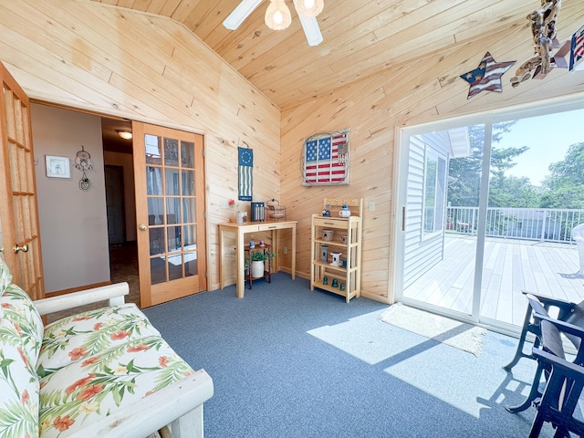 915 Stanton Ave, Fergus Falls, MN 56537 - sitting room with wooden walls, ceiling fan, vaulted ceiling, wood ceiling, and carpet floors