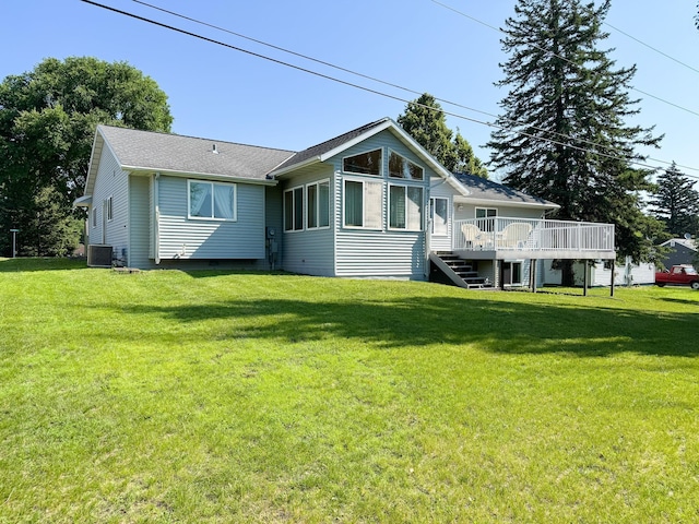 915 Stanton Ave, Fergus Falls, MN 56537 - back of house with a wooden deck, a yard, and stairs