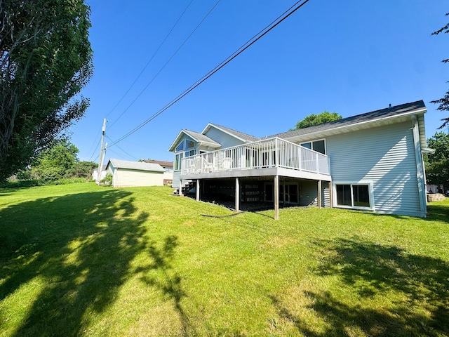 915 Stanton Ave, Fergus Falls, MN 56537 - back of property featuring a deck, a lawn, and stairs