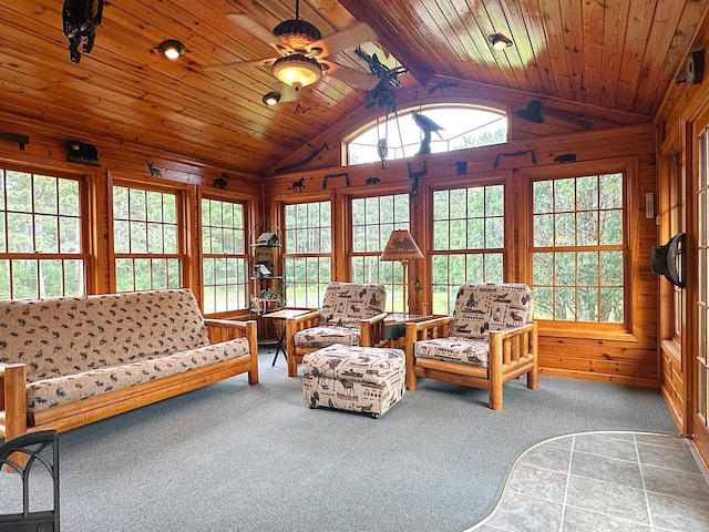 8180 Diane St, Circle Pines, MN 55014 - carpeted living area featuring lofted ceiling, wooden walls, healthy amount of natural light, and wooden ceiling