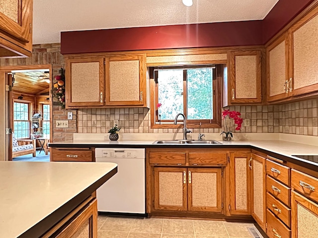 8180 Diane St, Circle Pines, MN 55014 - kitchen with dishwasher, tasteful backsplash, a textured ceiling, and brown cabinets