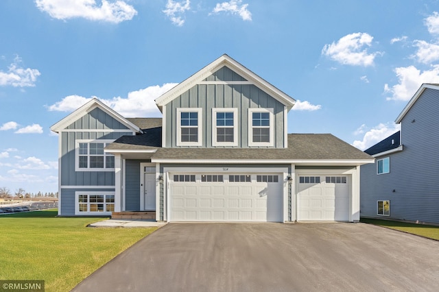 1013 2nd St NW, Delano, MN 55328 - view of front of home with board and batten siding, asphalt driveway, a front yard, and a shingled roof