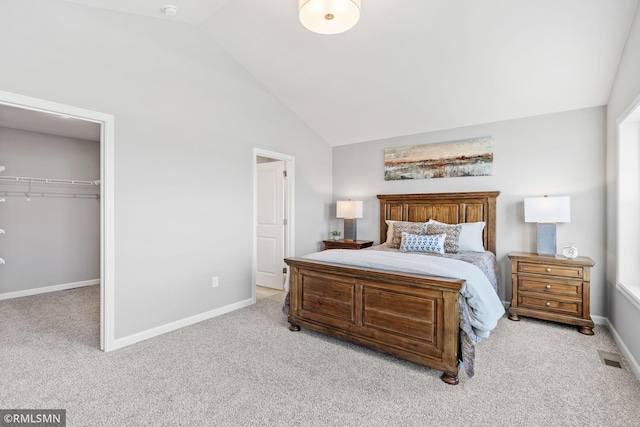 1013 2nd St NW, Delano, MN 55328 - carpeted bedroom with a walk in closet, a closet, and high vaulted ceiling
