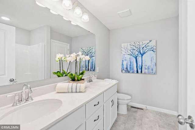 1013 2nd St NW, Delano, MN 55328 - bathroom with double vanity and a shower