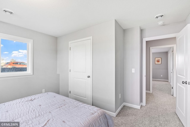 1013 2nd St NW, Delano, MN 55328 - bedroom with light carpet and baseboards