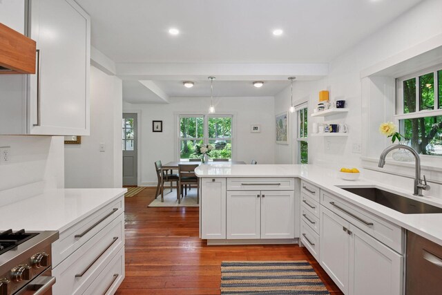 3815 Deephaven Ave, Deephaven, MN 55391 - kitchen featuring light countertops, plenty of natural light, dark wood finished floors, a peninsula, and recessed lighting