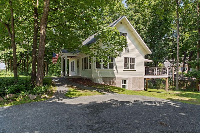 3815 Deephaven Ave, Deephaven, MN 55391 - view of front of property featuring driveway, a wooden deck, and a front yard
