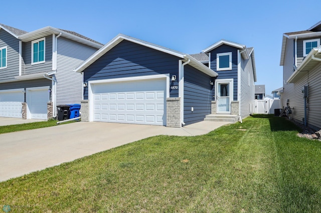 6870 17th St S, Fargo, ND 58104 - view of front of home with concrete driveway and entry steps