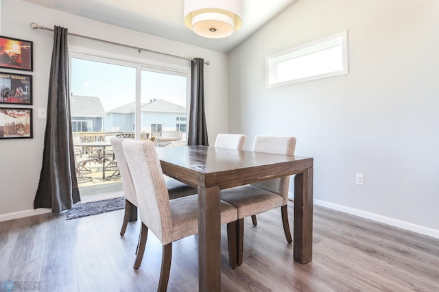 6870 17th St S, Fargo, ND 58104 - dining area featuring light wood finished floors and lofted ceiling