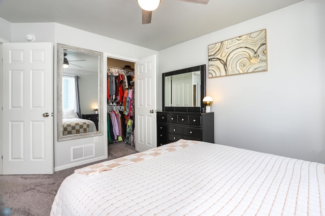6870 17th St S, Fargo, ND 58104 - carpeted bedroom featuring a closet, a spacious closet, and a ceiling fan