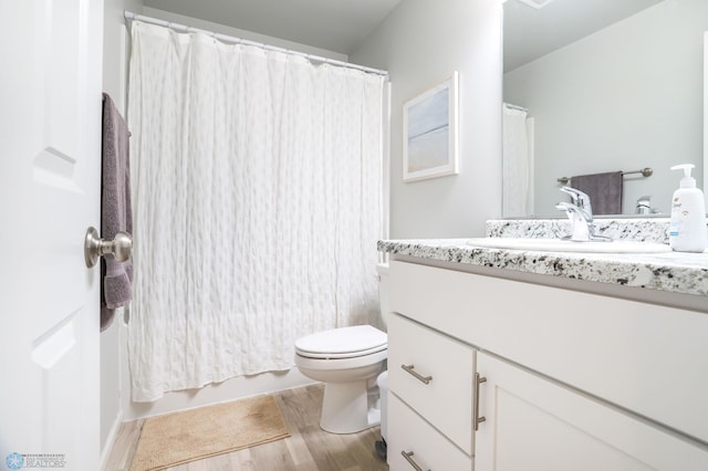 6870 17th St S, Fargo, ND 58104 - full bathroom featuring vanity, wood finished floors, and a shower with curtain