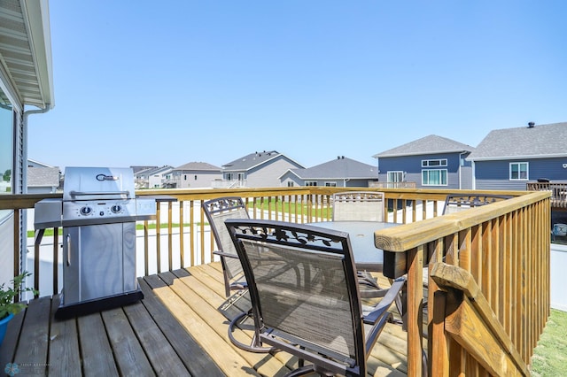 6870 17th St S, Fargo, ND 58104 - wooden deck with a residential view, a grill, and outdoor dining space