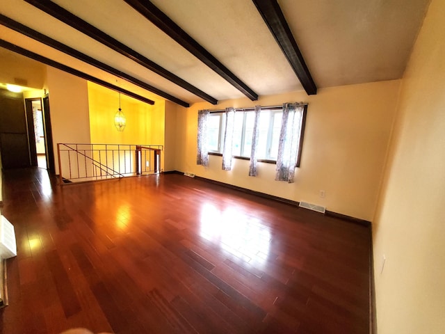 8921 49th Ave N, New Hope, MN 55428 - empty room featuring dark wood-style flooring and beamed ceiling