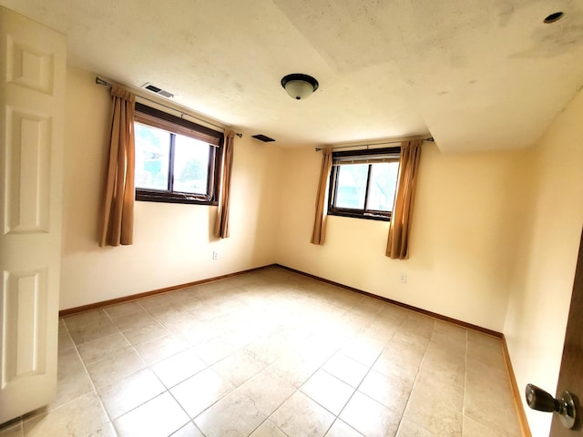 8921 49th Ave N, New Hope, MN 55428 - empty room featuring plenty of natural light and light tile patterned floors