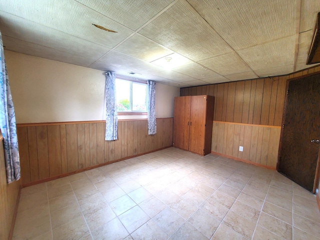8921 49th Ave N, New Hope, MN 55428 - unfurnished room with wood walls and wainscoting