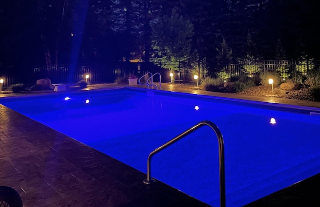 6707 Highland Hills Ln S, Cottage Grove, MN 55016 - view of pool at twilight