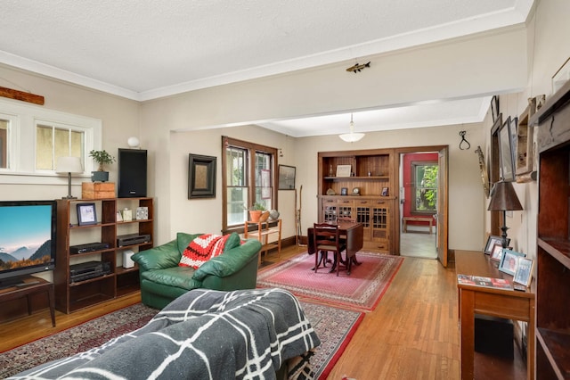 1914 Grand Ave, Saint Paul, MN 55105 - living area featuring wood finished floors and ornamental molding