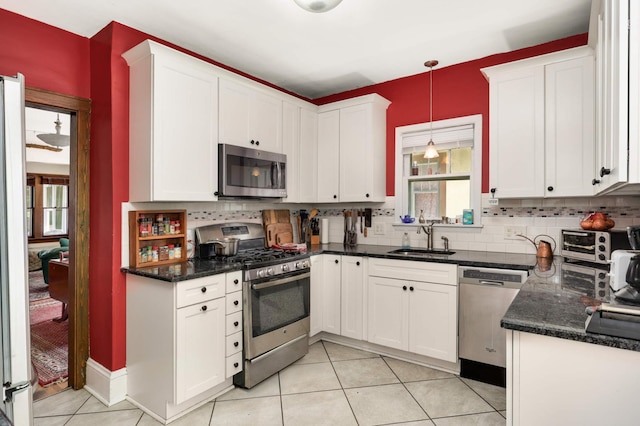 1914 Grand Ave, Saint Paul, MN 55105 - kitchen with appliances with stainless steel finishes and white cabinetry
