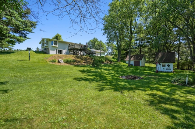 2160 35th Ave, Alden Twp, WI 54026 - view of grassy yard with a storage unit and a deck