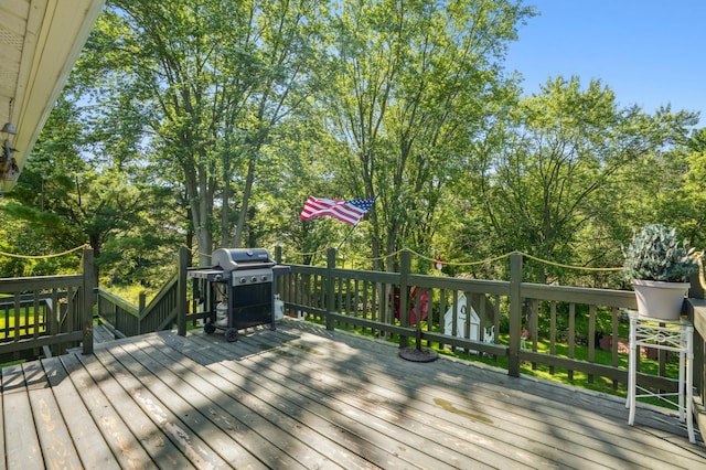 2160 35th Ave, Alden Twp, WI 54026 - deck featuring area for grilling, a shed, and view of scattered trees