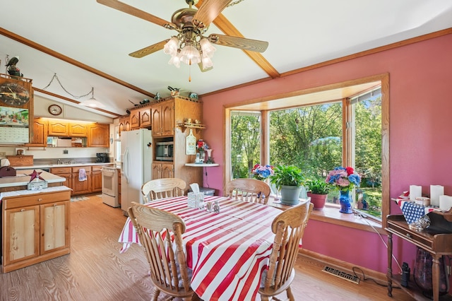 2160 35th Ave, Alden Twp, WI 54026 - dining area featuring light wood finished floors, vaulted ceiling, and a ceiling fan