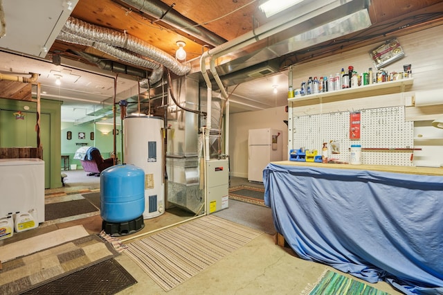 2160 35th Ave, Alden Twp, WI 54026 - unfinished below grade area with water heater, freestanding refrigerator, a water pressure tank, heating unit, and washer / clothes dryer
