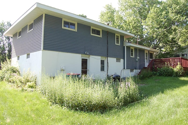 1445 Ottawa Ave S, Golden Valley, MN 55416 - rear view of house with a deck and stucco siding
