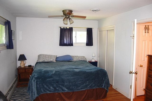 1445 Ottawa Ave S, Golden Valley, MN 55416 - bedroom featuring a baseboard radiator, wood finished floors, a closet, and a ceiling fan