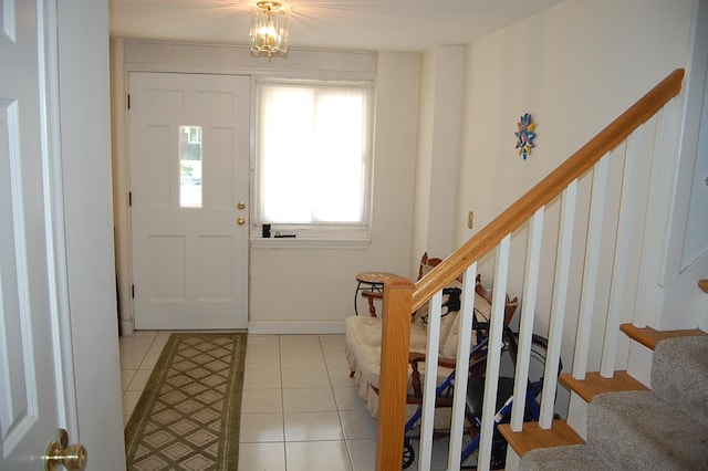1445 Ottawa Ave S, Golden Valley, MN 55416 - foyer with stairs, light tile patterned flooring, and a chandelier