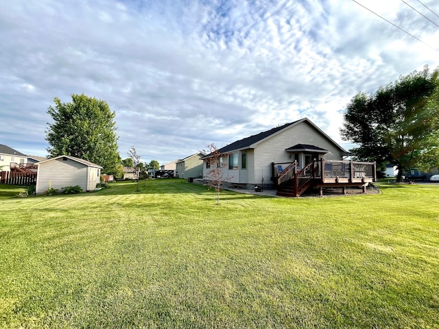 24482 18th Ave, Saint Augusta, MN 56301 - view of green lawn featuring a wooden deck and a storage shed