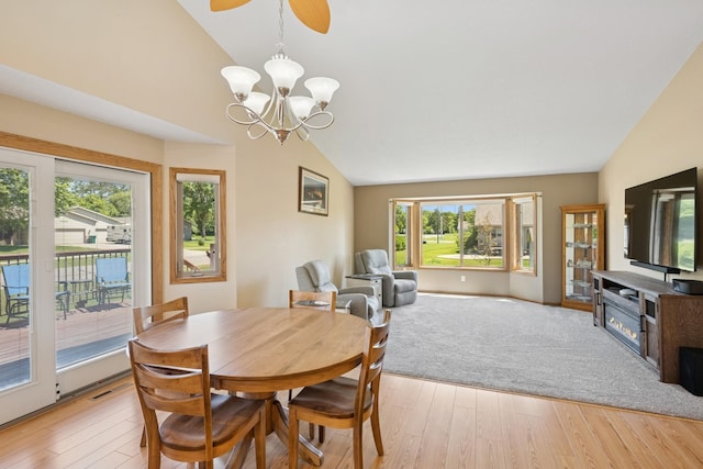 24482 18th Ave, Saint Augusta, MN 56301 - dining area featuring vaulted ceiling, a chandelier, light wood-style flooring, and ceiling fan