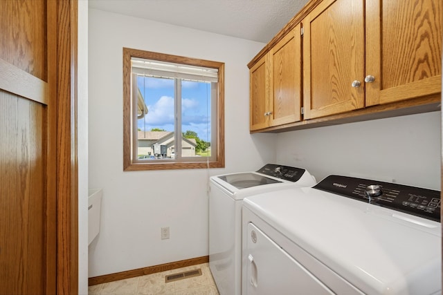 24482 18th Ave, Saint Augusta, MN 56301 - laundry area featuring independent washer and dryer and cabinet space