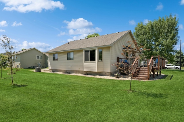24482 18th Ave, Saint Augusta, MN 56301 - rear view of house with a wooden deck, a yard, a shingled roof, and stairs