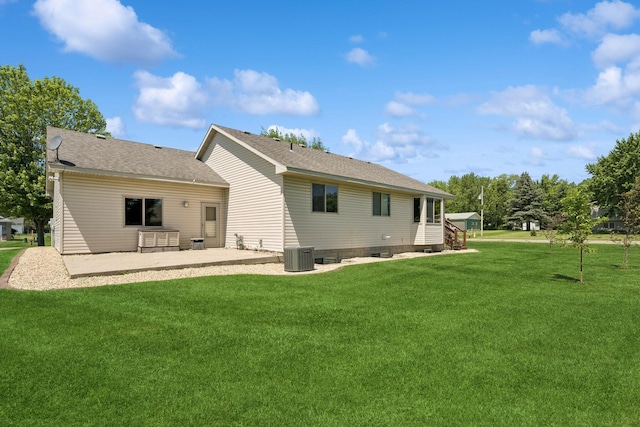 24482 18th Ave, Saint Augusta, MN 56301 - rear view of house with a patio area, a lawn, and a shingled roof