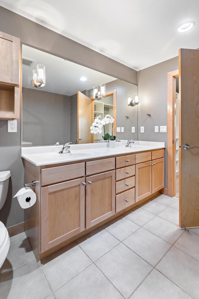 317 Groveland Ave Unit 106, Minneapolis, MN 55403 - bathroom featuring double vanity and tile patterned flooring