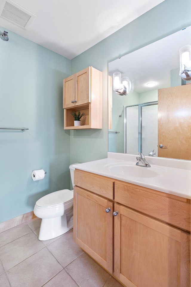 317 Groveland Ave Unit 106, Minneapolis, MN 55403 - bathroom featuring vanity, tile patterned floors, and a shower with shower door