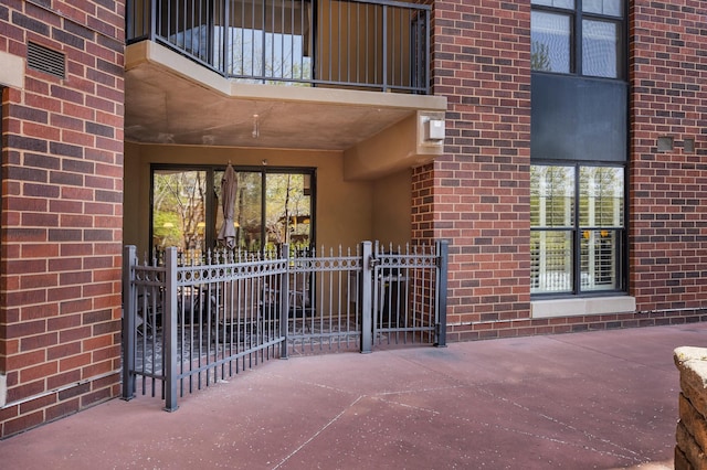 317 Groveland Ave Unit 106, Minneapolis, MN 55403 - property entrance featuring brick siding and a balcony