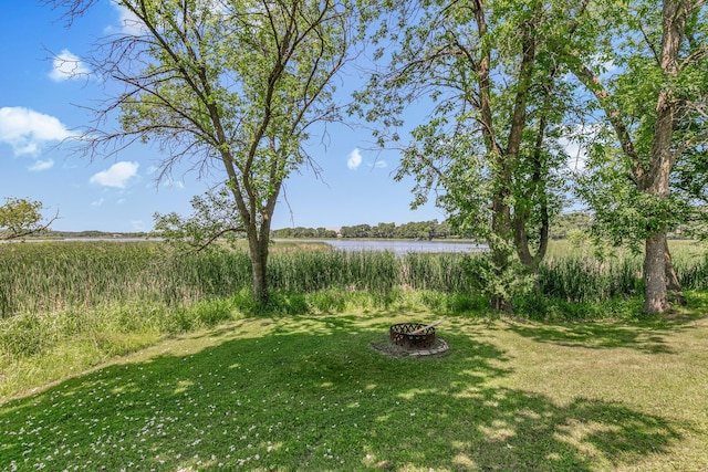 33027 County Road 50, Avon Twp, MN 56310 - view of green lawn featuring a water view and a fire pit