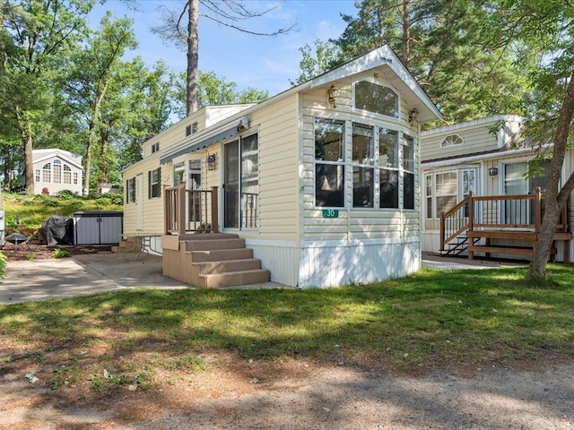 15827 Wilderness Trl Unit 30, Crosslake, MN 56442 - view of front of property featuring a front lawn